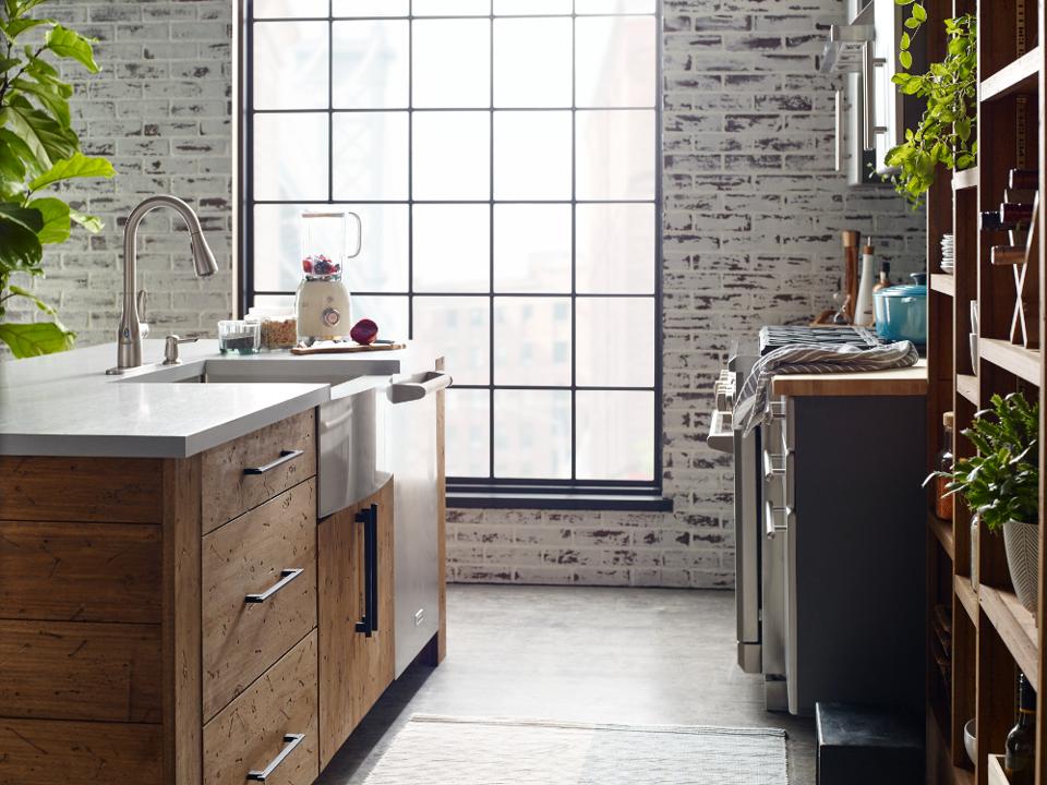 A touchless faucet in a kitchen sink.