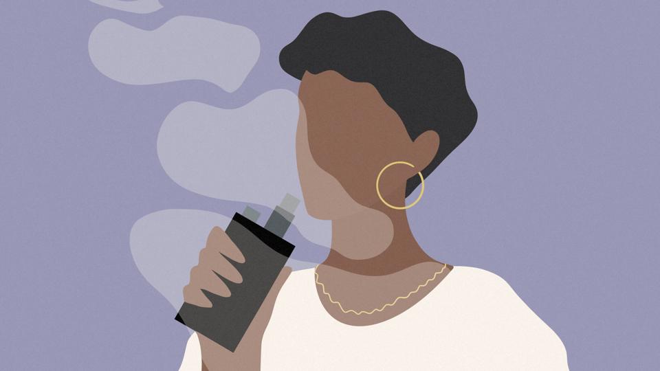 Woman vaping cannabis with a handheld vaporizer