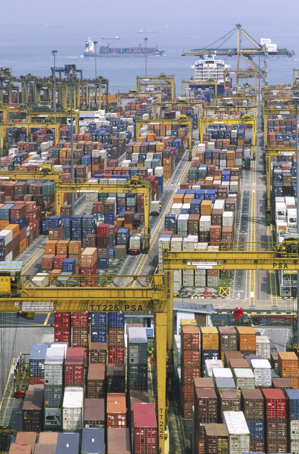 Port of Singapore Authority PSA container cranes stacking the thousands of containers which pass through the largest throughput container handling facilities in the world
