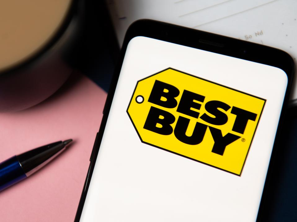 In this photo illustration a Best Buy logo displayed on a...