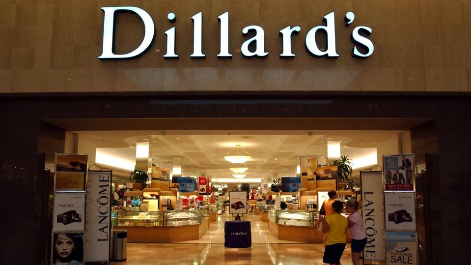 Shoppers enter the Dillard's store at the Broward Mall in Plantation, Florida, on Wednesday, August 20, 2003. Dillard's Inc. had a second-quarter loss of $50.4 million as sales fell after the 65-year-old department-store company reduced prices to try to keep shoppers from going to discounters and retailers such as Kohl's Corp.Shares of Dillard's declined as much as 13 percent. Photographer: Richard Sheinwald/Bloomberg News