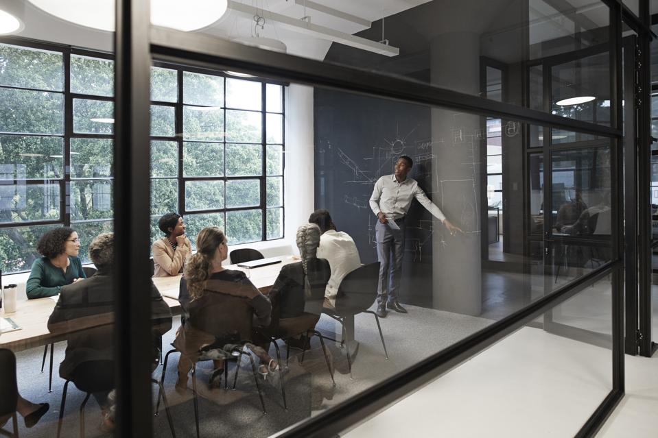 Businessman with coworkers in conference room
