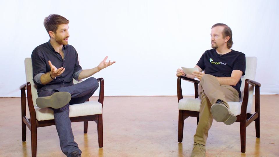 Tristan Harris and John Cumbers sitting and talking.