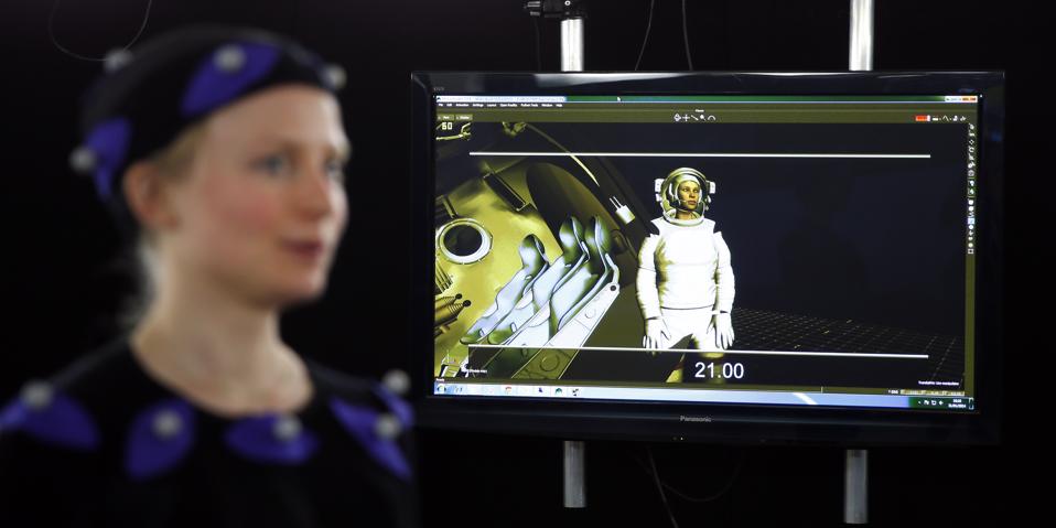 a computer-generated image of AFP journalist Helen Perceval (L) as she is filmed wearing a motion capture suit in a special effects studio