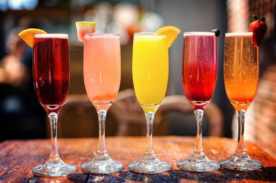 Assortment of Colorful Brunch Cocktails, Including Mimosas and Other Fruit Concoctions