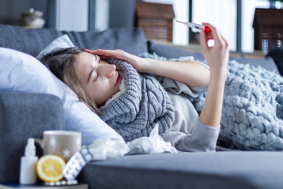 Woman suffering from cold and flu. Health care concept