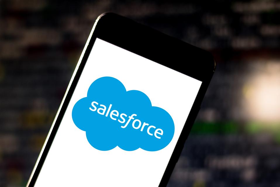 In this photo illustration a Salesforce logo is displayed on...