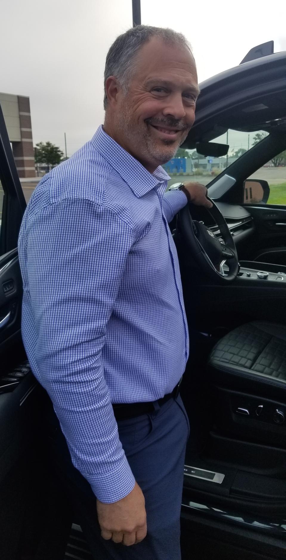 Maiorana leans into a 2021 Cadillac Escalade, equipped with enhanced Super Cruise.