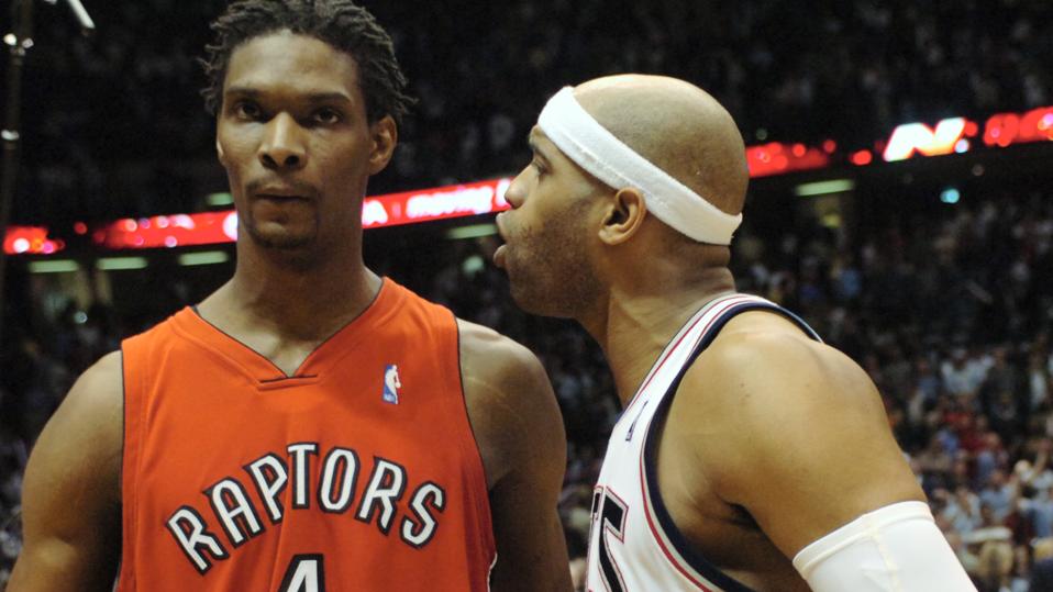 Raps V Nets - 05/04/07 - EAST RUTHERFORD, NEW JERSEY - Vince Carter speaks with Chris Bosh at the co