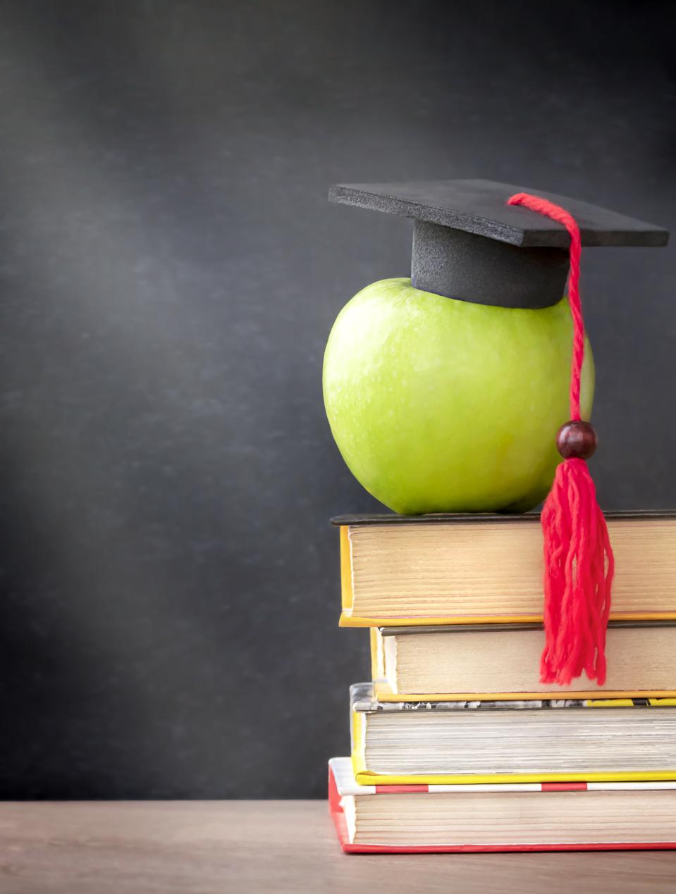 green apple with mortar board