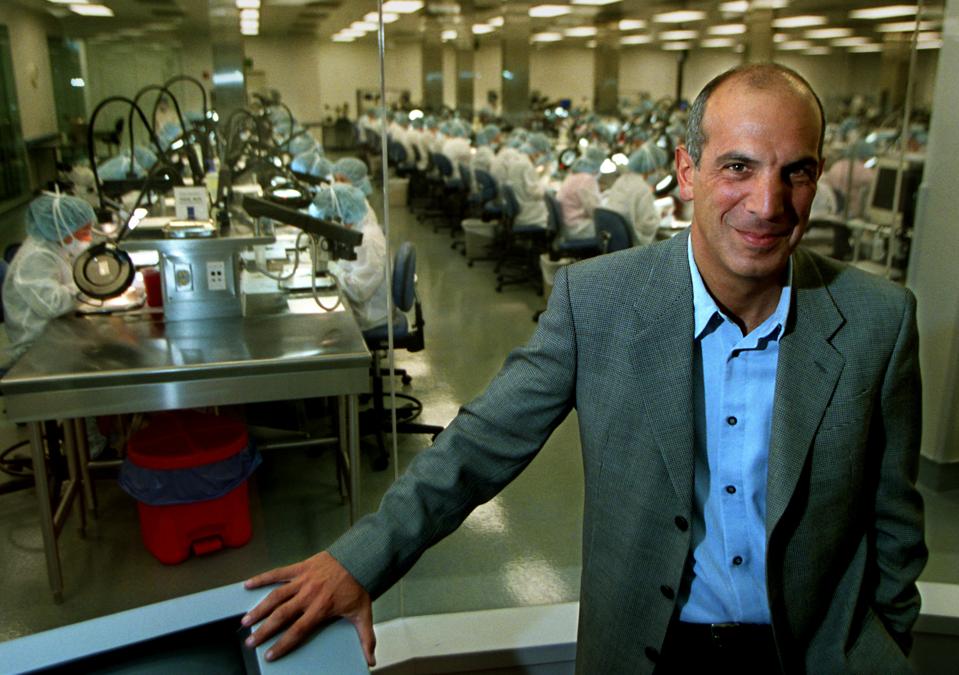 032857.FI.0711.heart.1.RLIrvineEdwards Lifesciences CEO Michael Mussallem stands near a window t