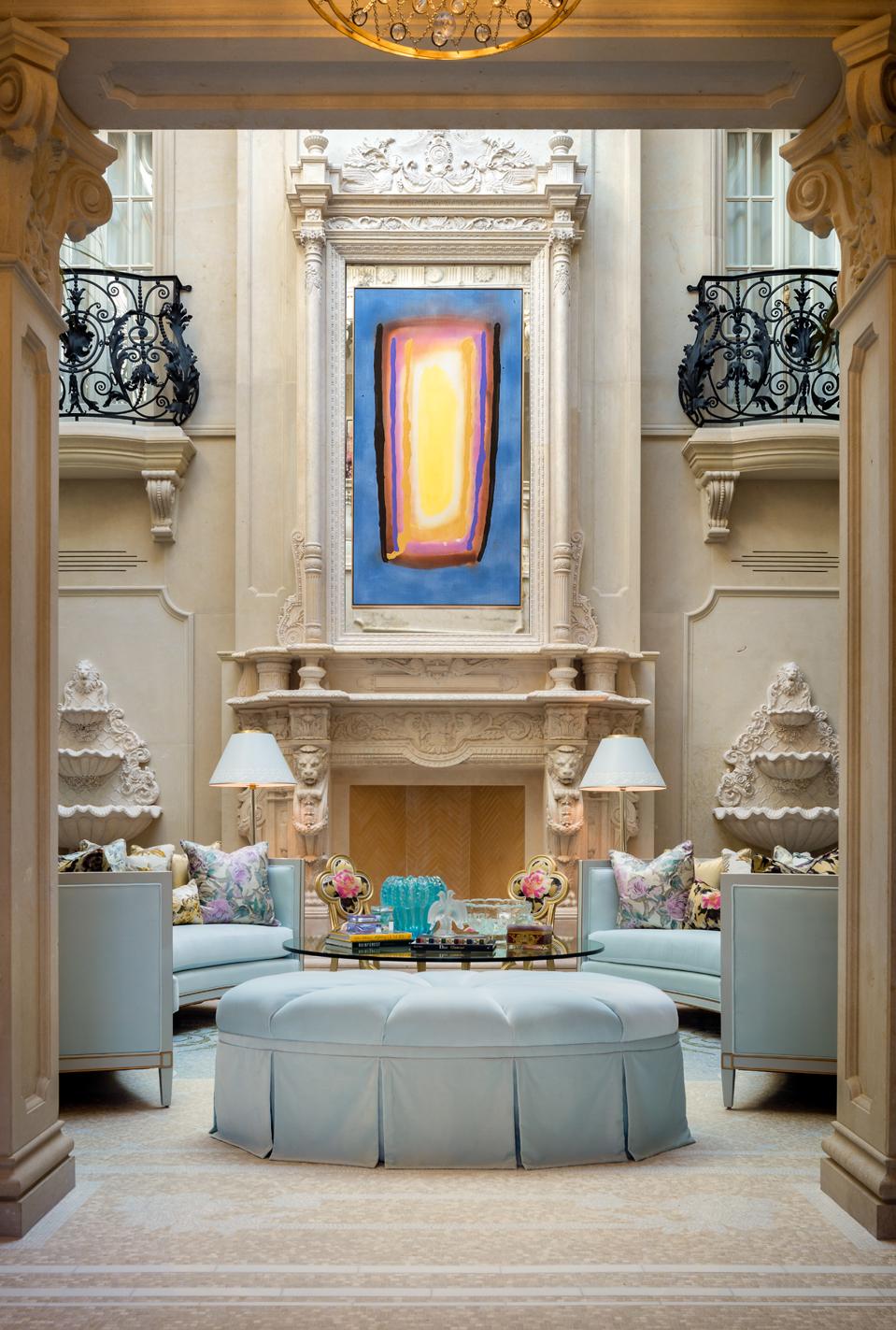 A French Chateau-inspired home, with traditional molding, pastel hues and contemporary art.