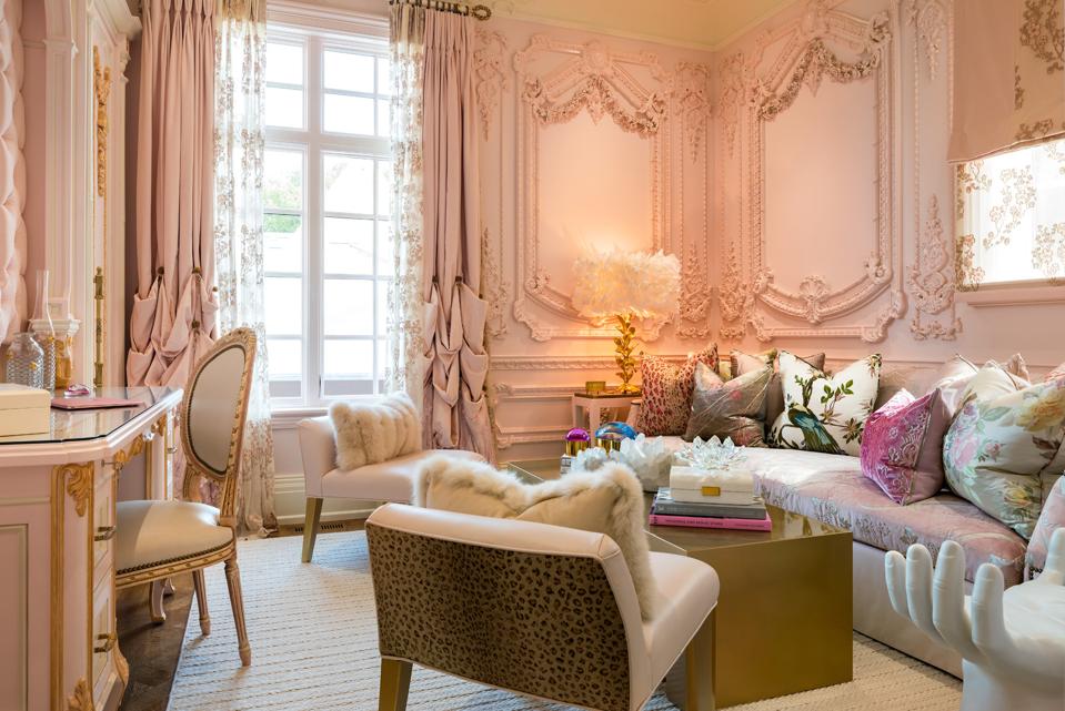 A pastel-hued room with contemporary furniture.