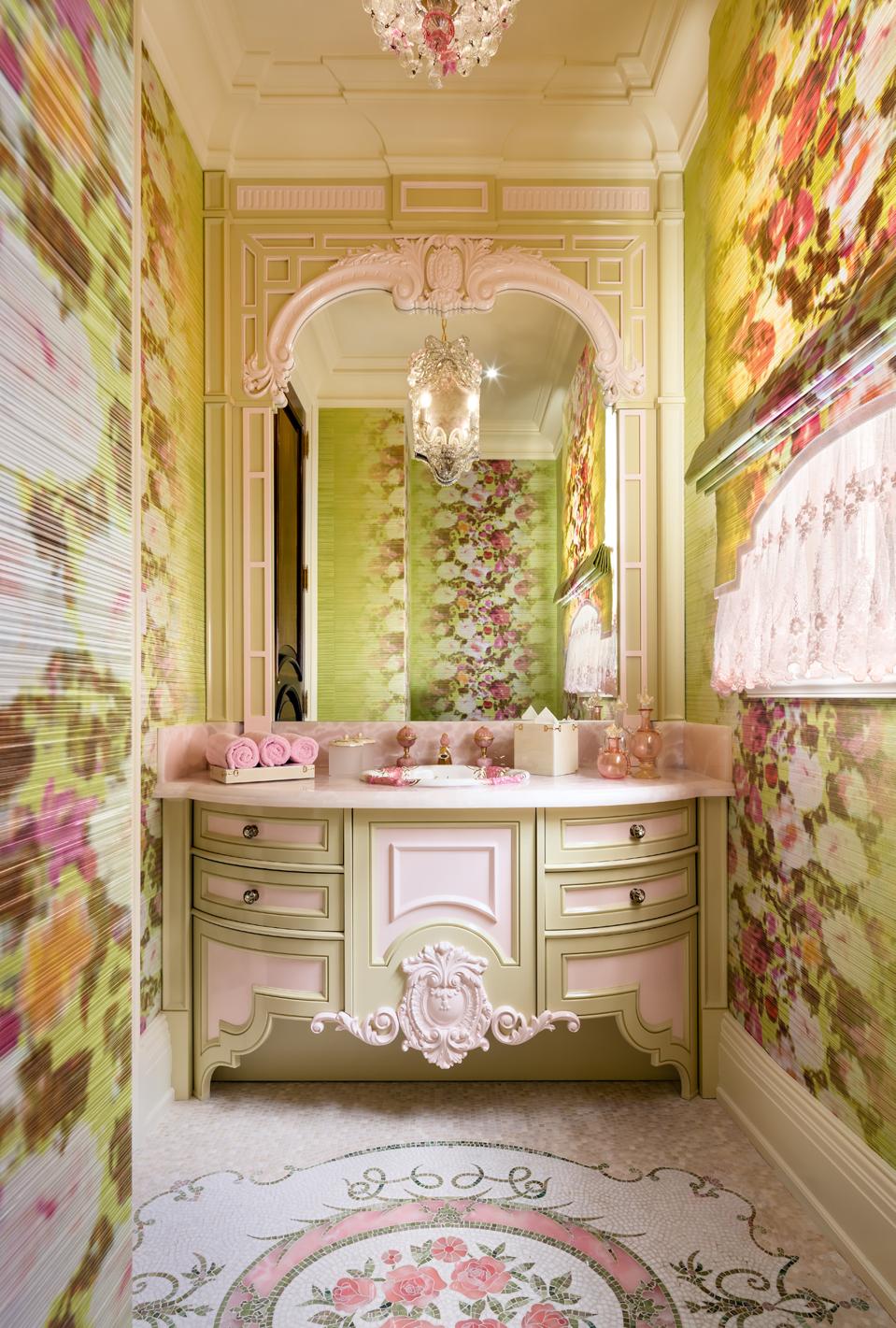 A beautiful bathroom with mosaic tiling and fabric pleated wallpaper.