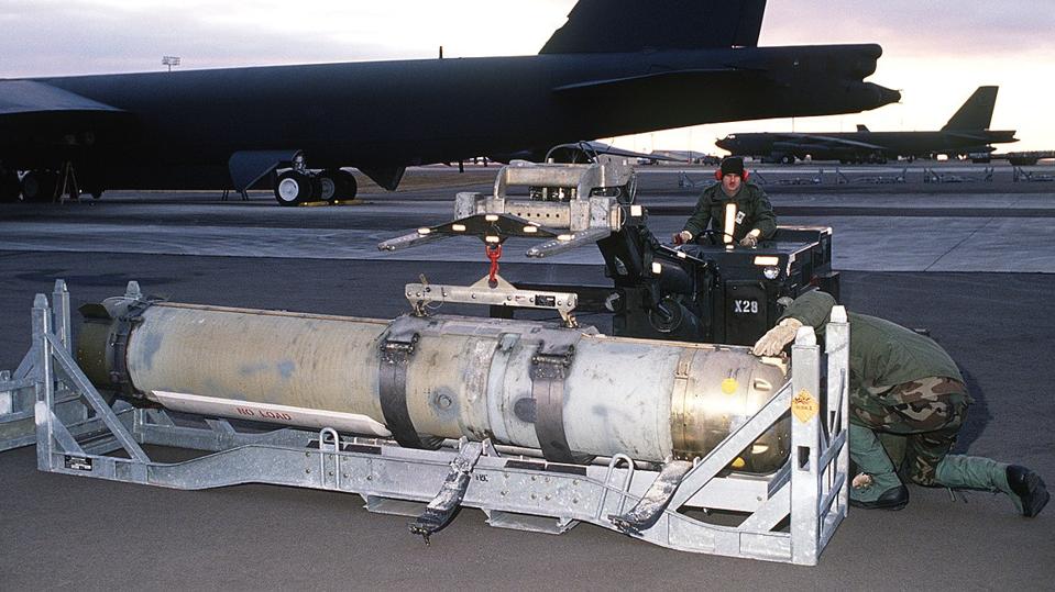 A mine being loaded on to a bomber