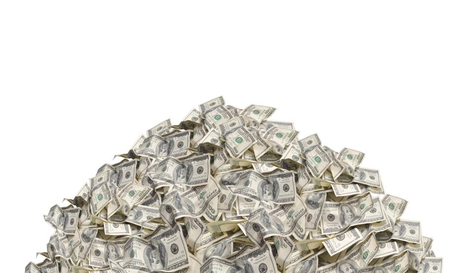 Pile with American one hundred dollar bills isolated on white background