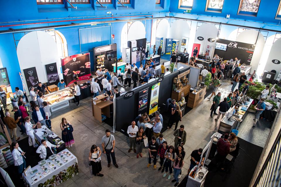 People visit presentation stands and tasting booths at a chefs' congress in Portugal