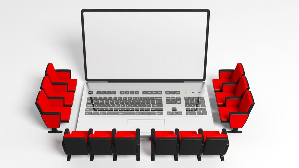 Cinema chairs around a laptop, blank white screen for copyspace, white background. 3d illustration
