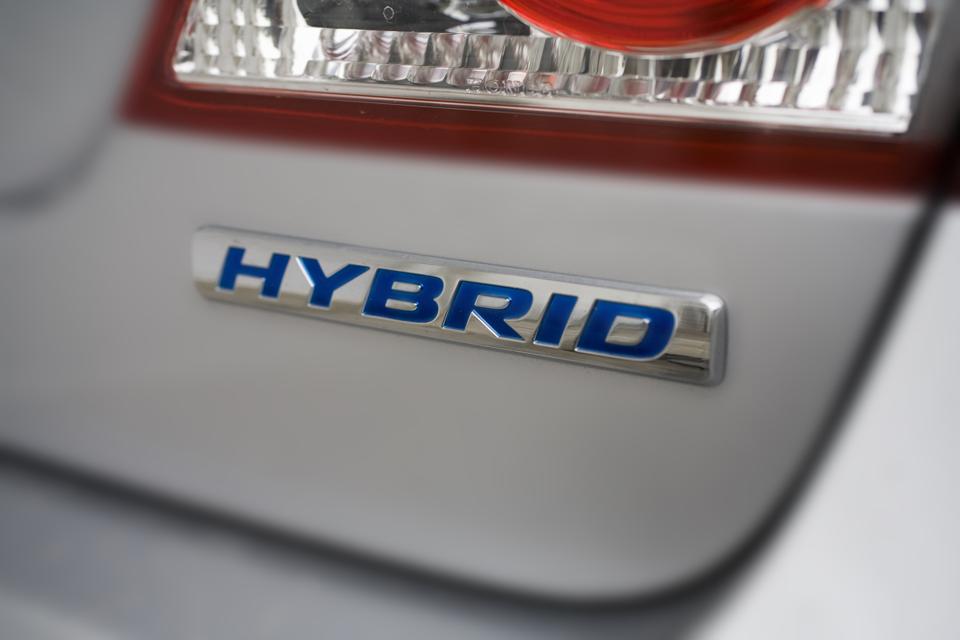 Hybrid logo on rear of car.