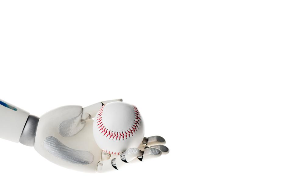 A robot hand holding a baseball.