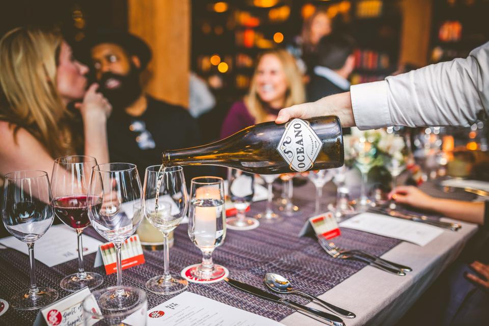 Oceano Chardonnay being poured at a tasting dinner.