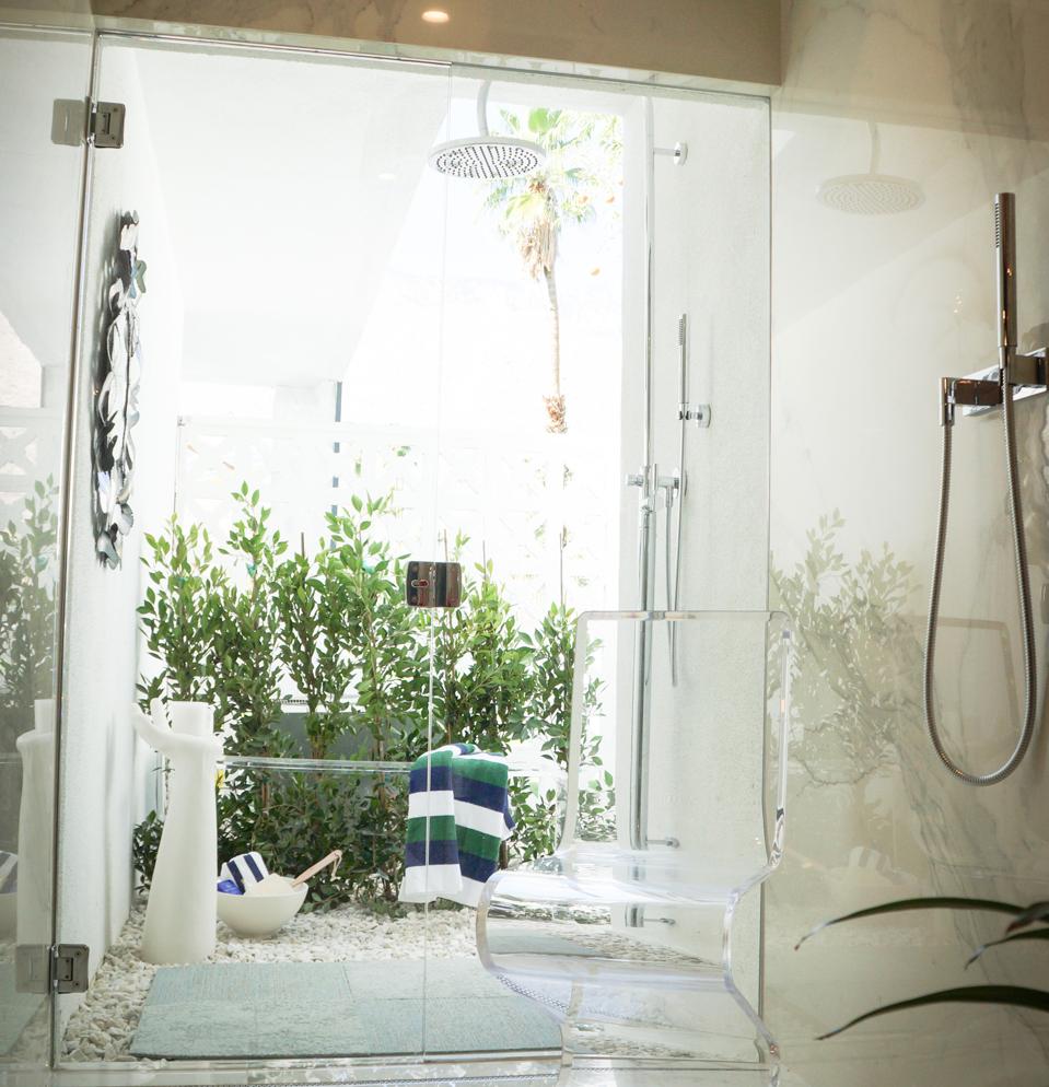 Shower with outdoor courtyard extension.