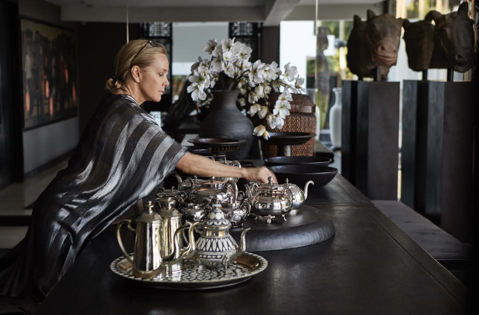The designer with silver teapots from her Curated by MF home decor collection.
