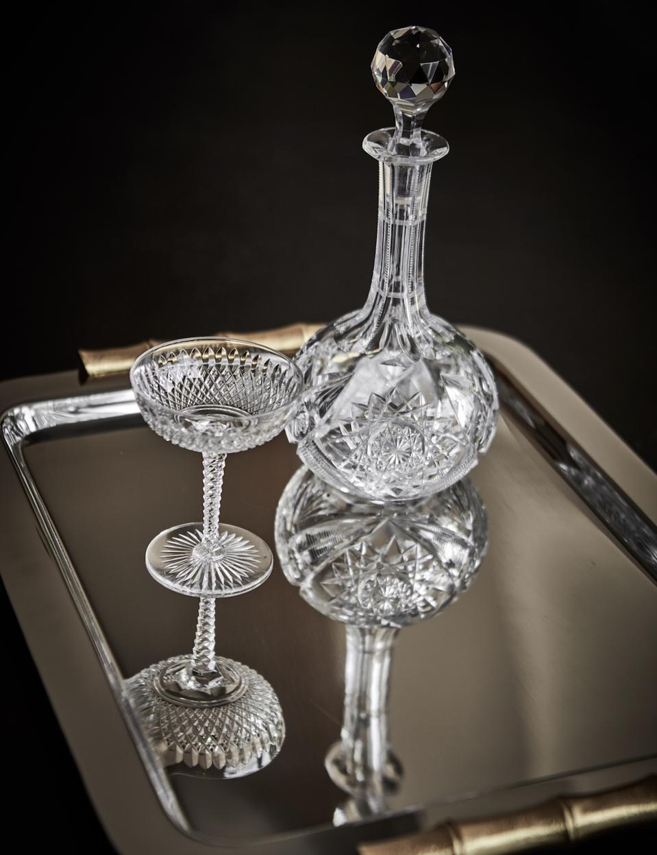 A crystal decanter and coupe glass.