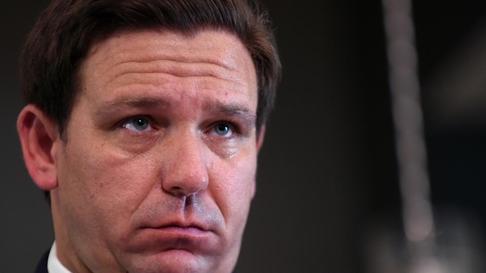 Florida Governor Ron DeSantis listens to a question from the...