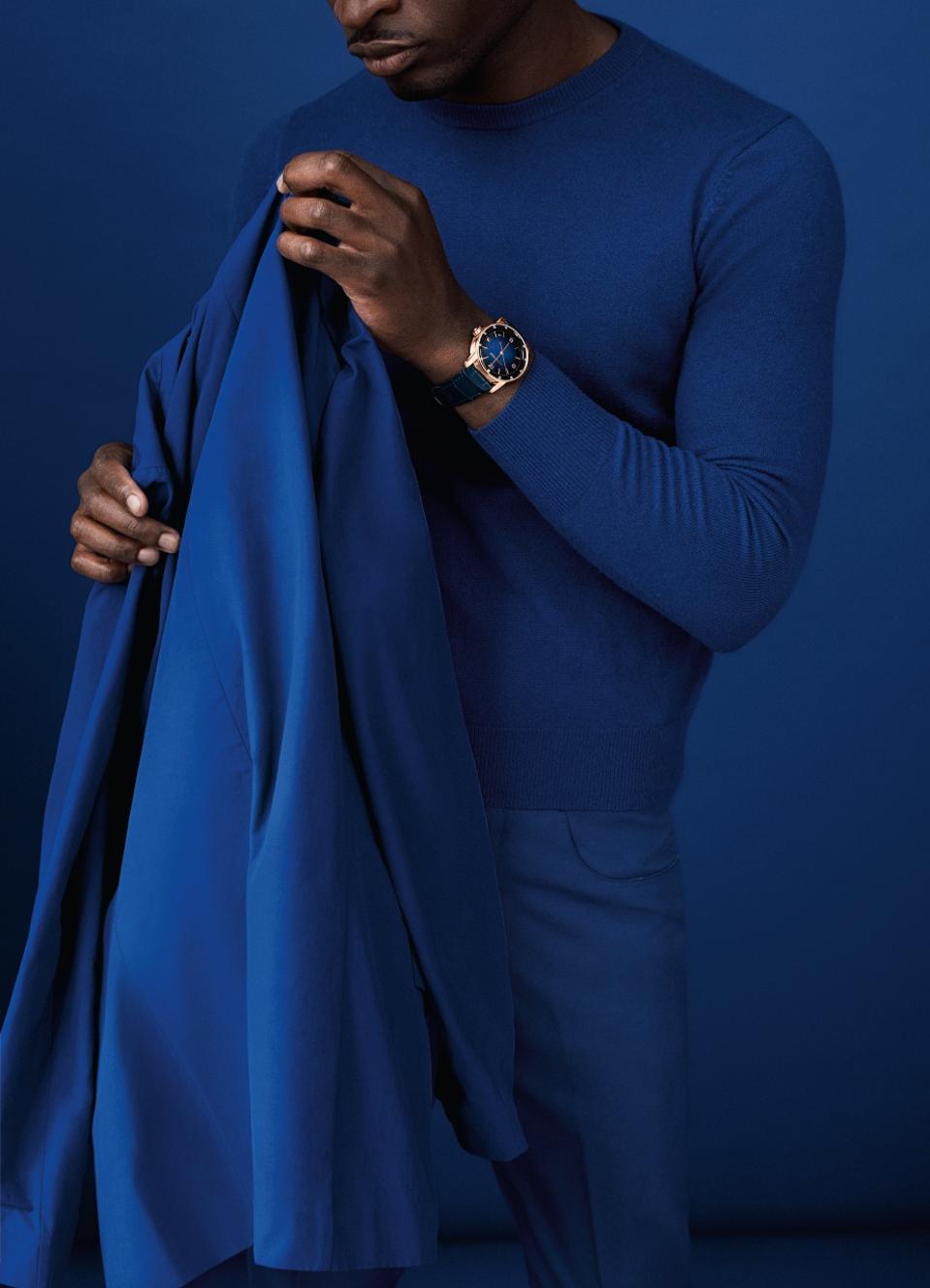 The Code 11.59 by Audemars Piguet Selfwinding features a 18-karat pink gold case with a smoked blue lacquered dial with sunburst pattern.