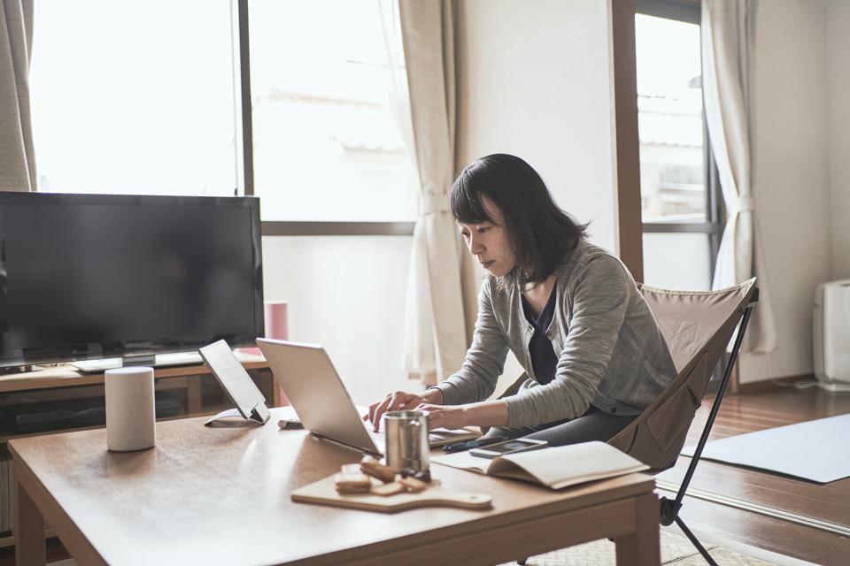 Asian female worker working from Home.