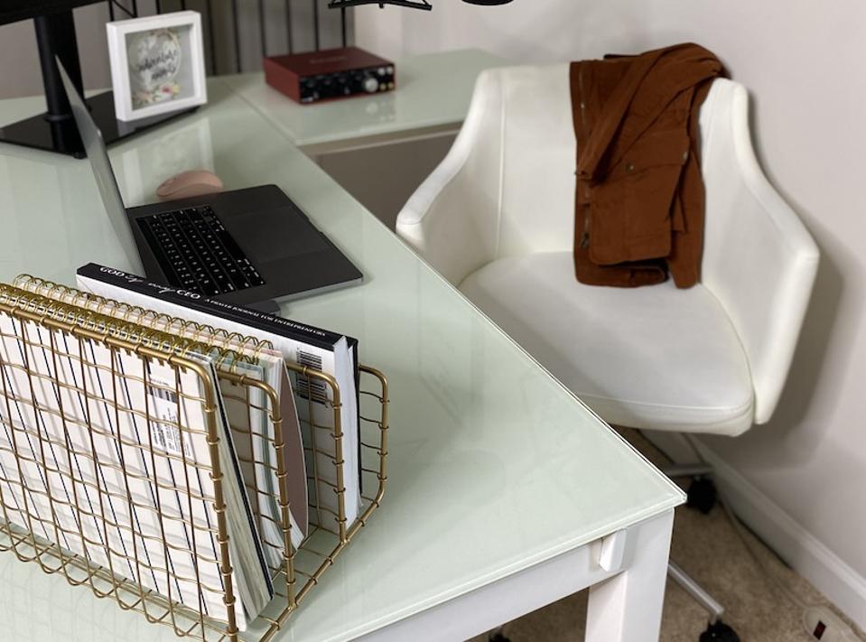 Home office with a white desk and white chair