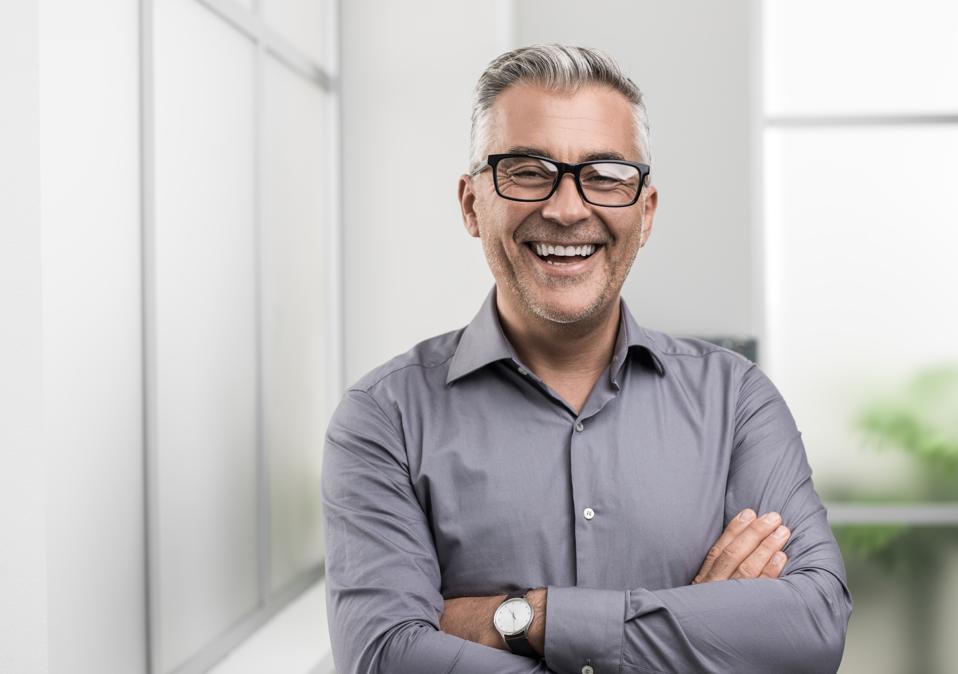 Confident businessman posing in the office