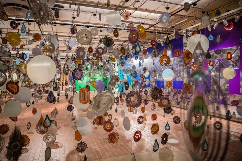 Nick Cave, 'Kinetic Spinner Forest,' 2016. Custom and off the shelf wind spinners, cables, motors. Installation photo at the Momentary, Bentonville, AR.