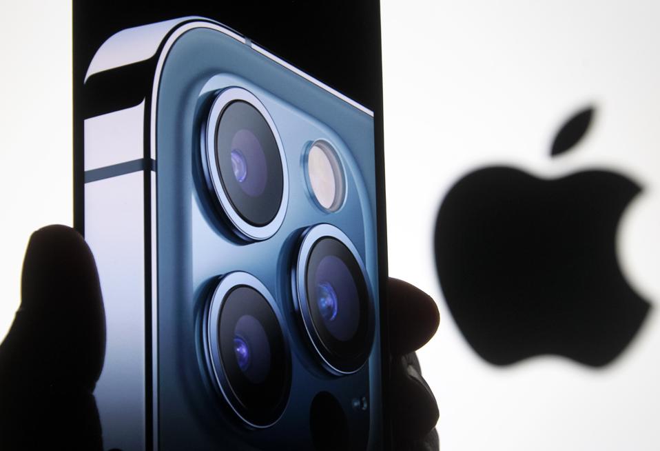 In this photo illustration a screenshot from Apple's launch...