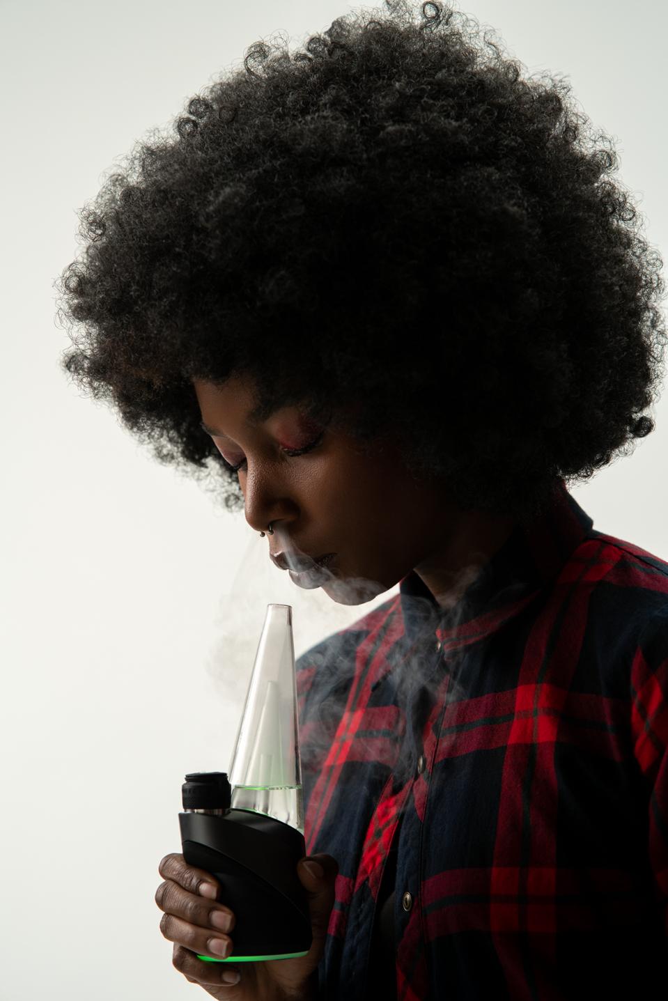 A person uses the Puffco Peak Pro vaporizer. The Peak Pro is the company's fastest-selling device.