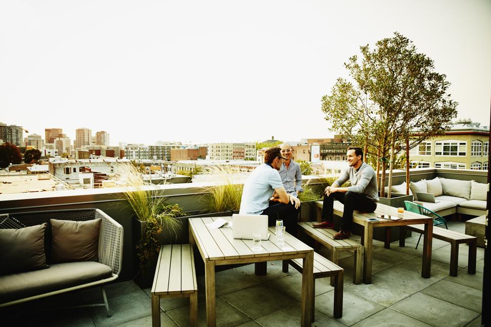Colleagues having meeting on office terrace