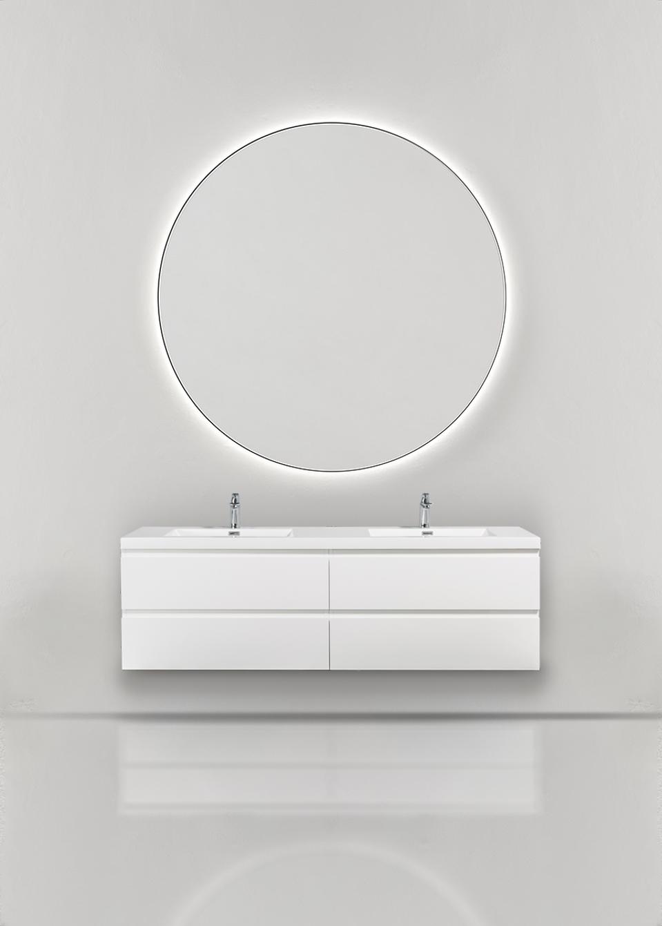 A beautiful illuminated circular mirror above a sink.