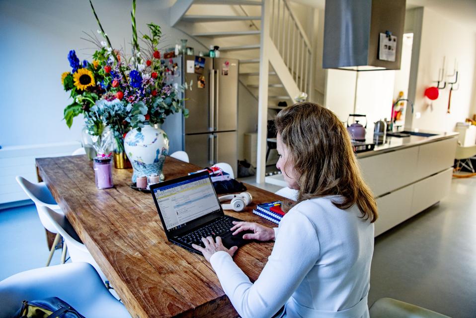 A woman working from home as a preventive measures against...