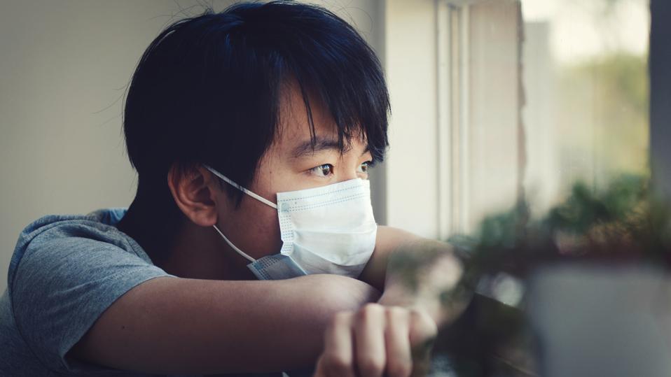 Young Asian boy in home quarantine