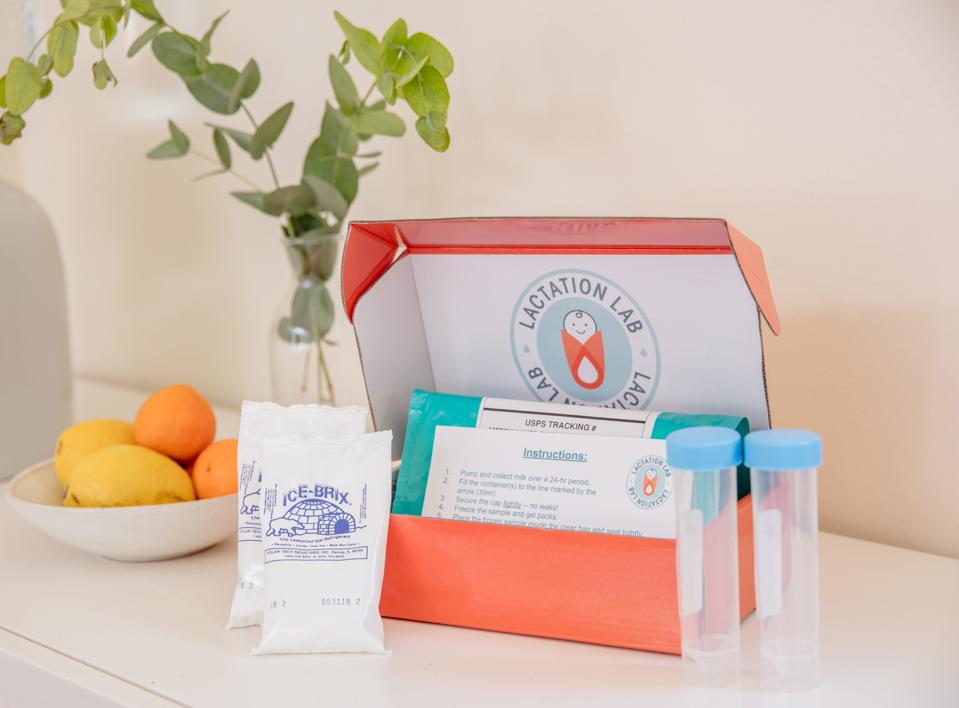 Lactation Lab's test kit featuring a box with test tubes, ice packs and more.