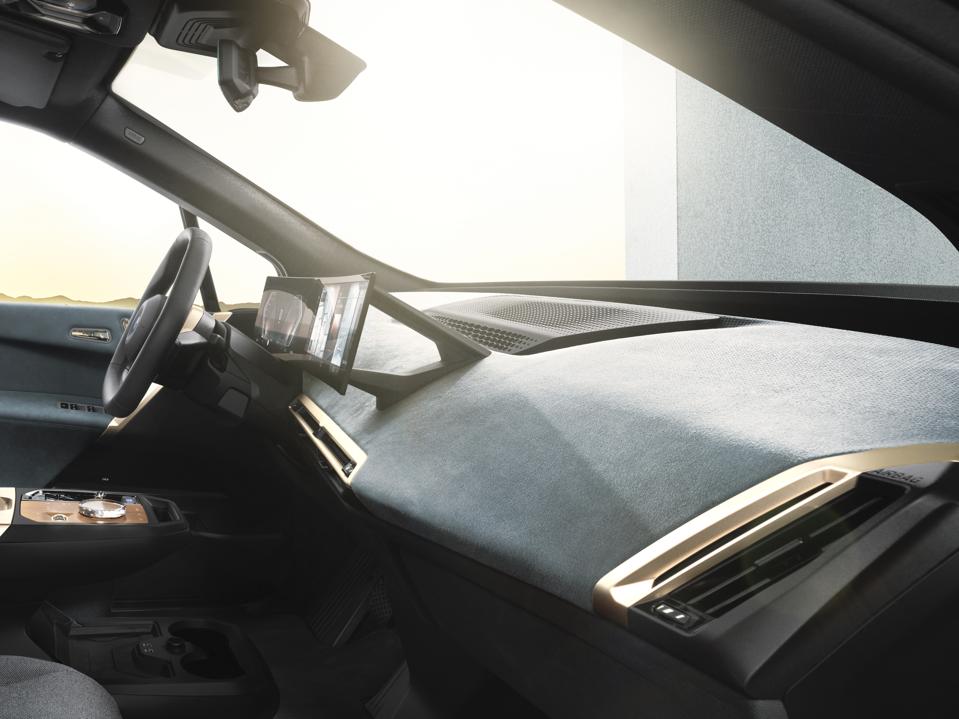 The BMW iX instrument cluster has a far more pronounced curve than we've seen before.