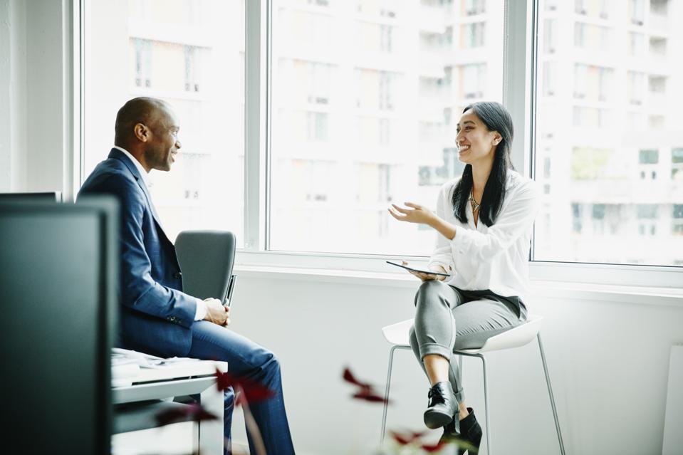 Businesswoman leading informal project meeting