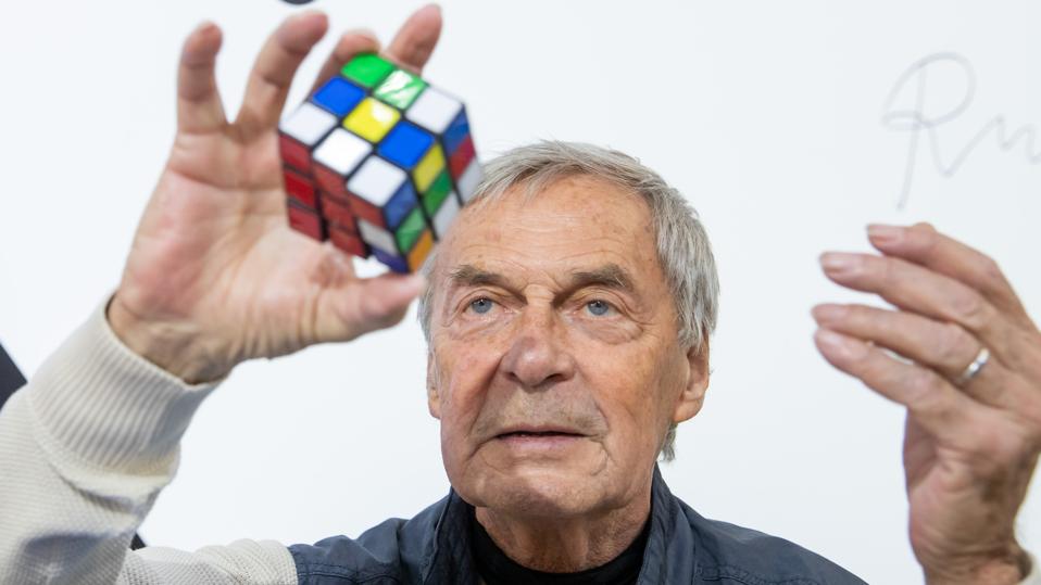 Erno Rubik, inventor of the Rubik's Cube, holding one of his Rubik's Cube puzzles.
