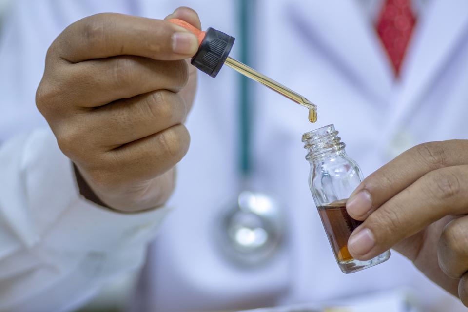 Glass bottle handle, CBD hemp oil.