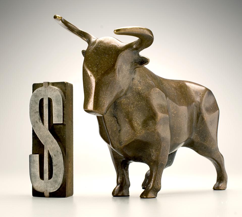 Bull statuette and dollar