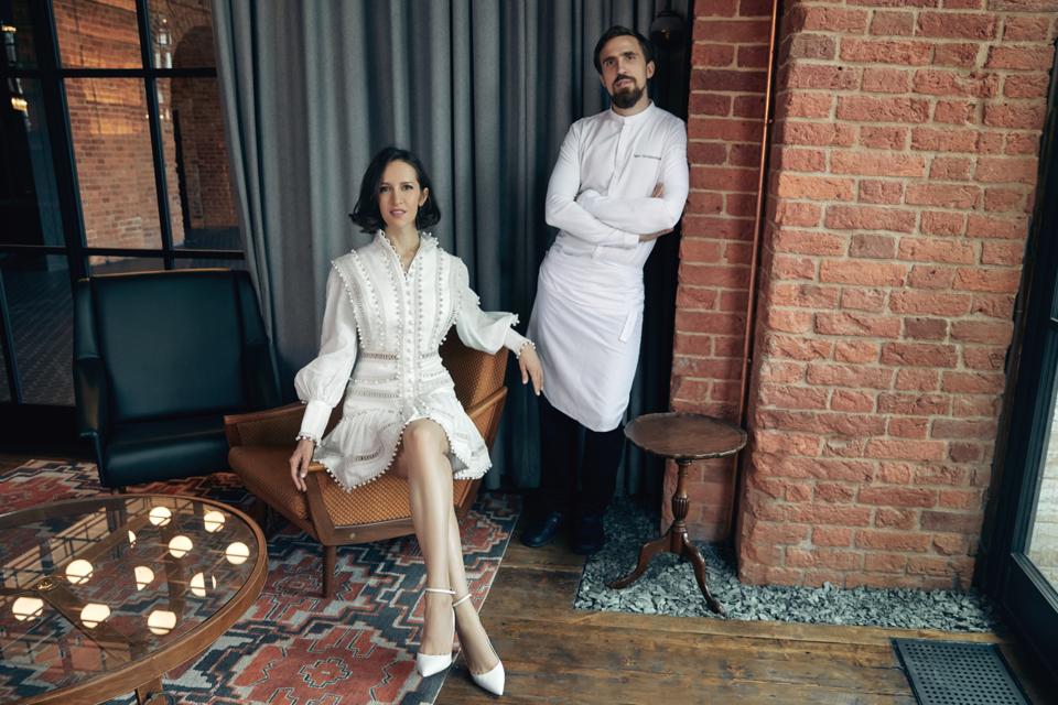 The restaurateur and chef pose in a lounge at a restaurant in St. Petersburg, Russia