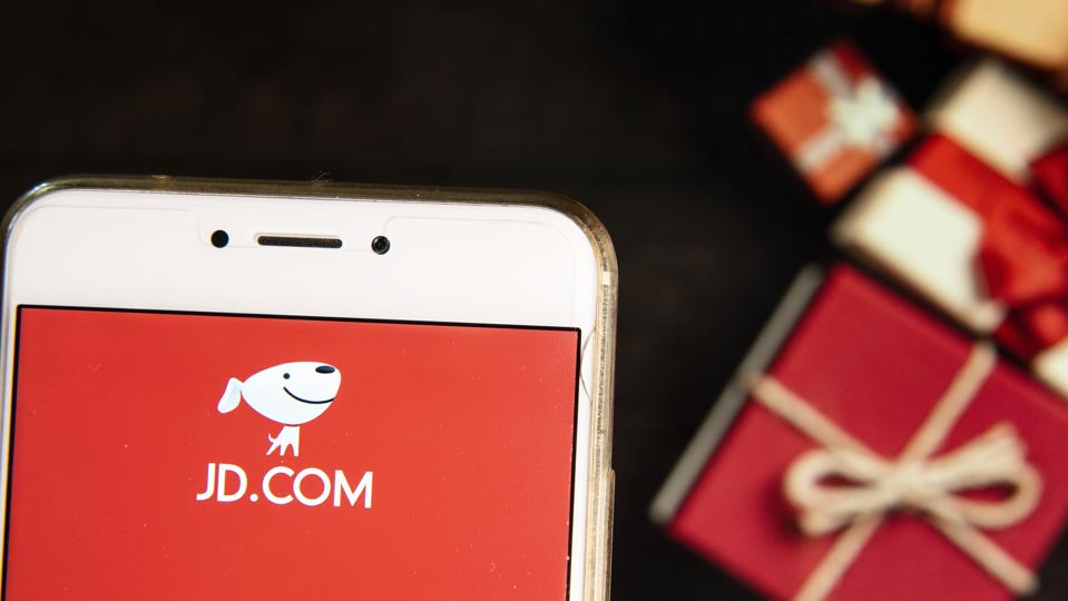 American Chinese e-commerce company JD.com logo with presents in background.