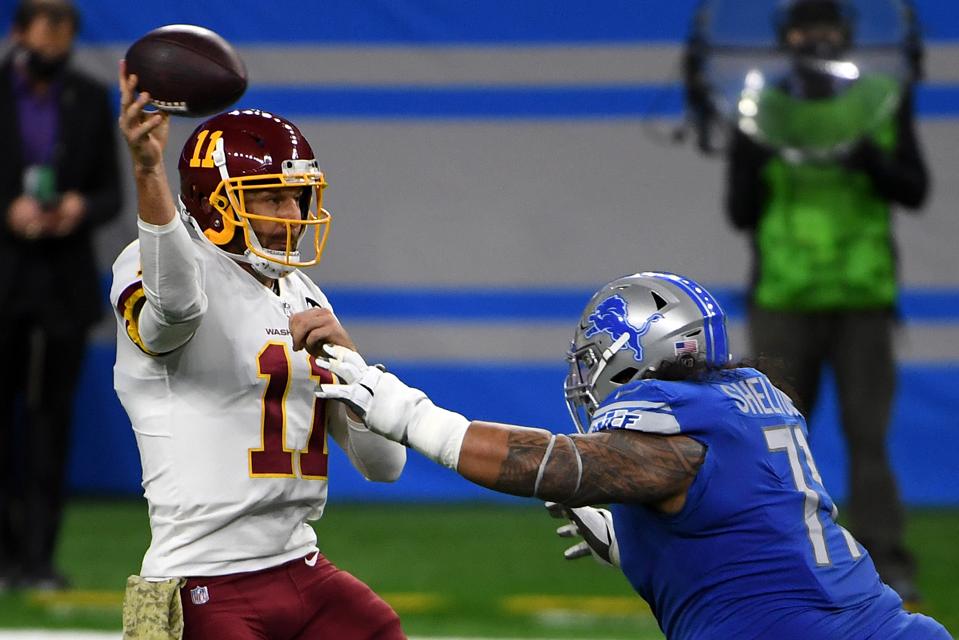 Danny Shelton #71 of the Detroit Lions attempts to sack Alex Smith #11 of the Washington Football Team during their game at Ford Field on November 15, 2020 in Detroit, Michigan. (Photo by Nic Antaya/Getty Images)