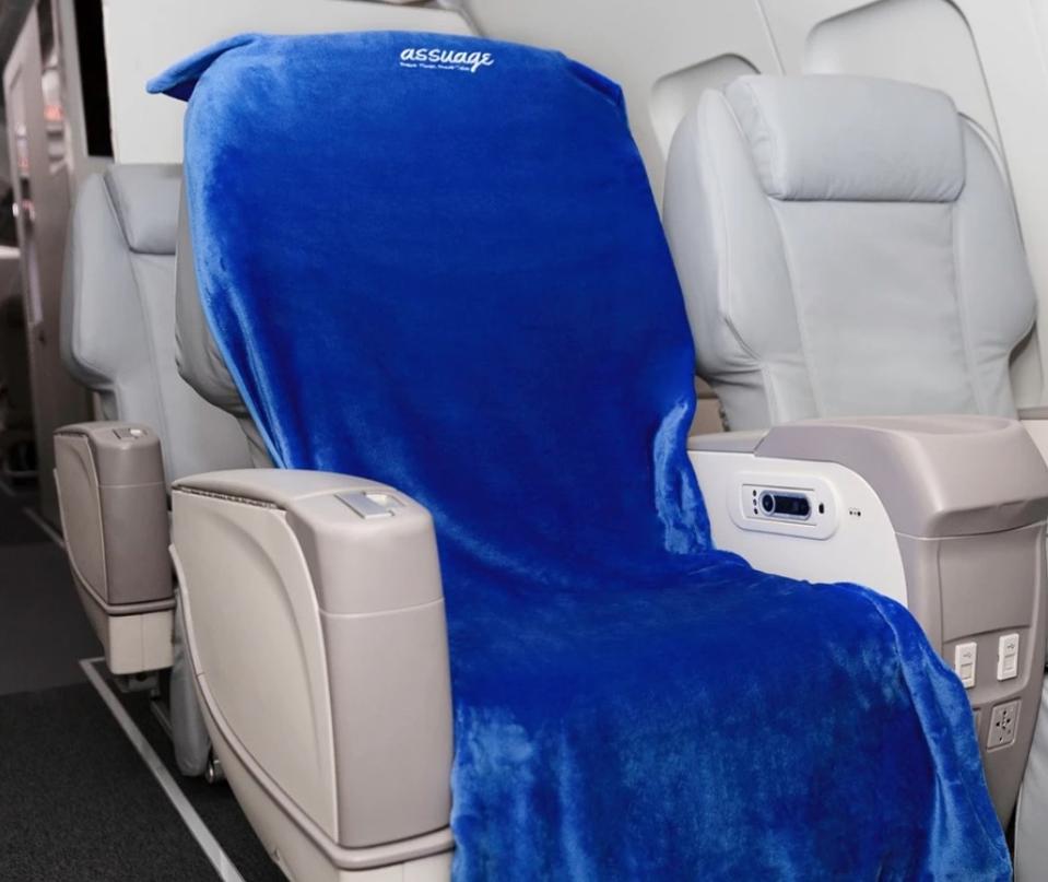 Cover your dirty airplane seat with this cozy protector.